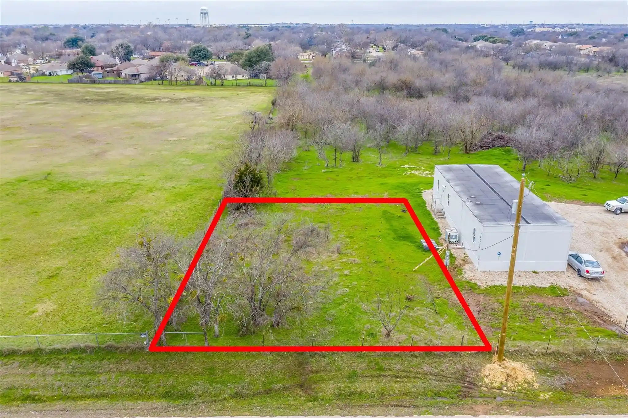 Photo 1 of Land for sale at 303 N Industrial Blvd, Crowley, TX 76036 | MLS# 21296951 | Listing updated on 2026-10-17