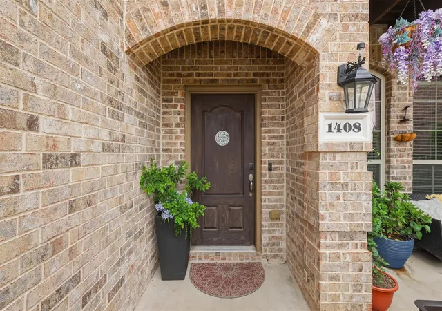 Photo 2 of Townhouse for sale at 1408 Arapaho Dr, Carrollton, TX 75010 | MLS# 21305931 | Listing updated on 2026-08-26
