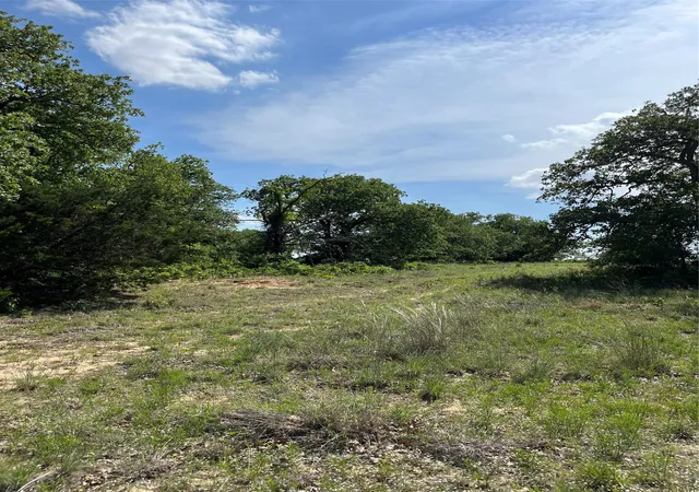 Photo 1 of Land for sale at Lot 12 Clare Rd, Poolville, TX 76487 | MLS# 21309185 | Listing updated on 2026-08-22