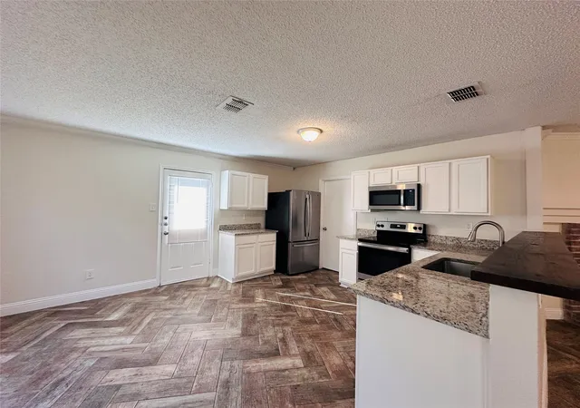 Photo 2 of Single family home for sale at 1418 Mill Branch Dr, Garland, TX 75040 | MLS# 21354068 | Listing updated on 2026-10-07