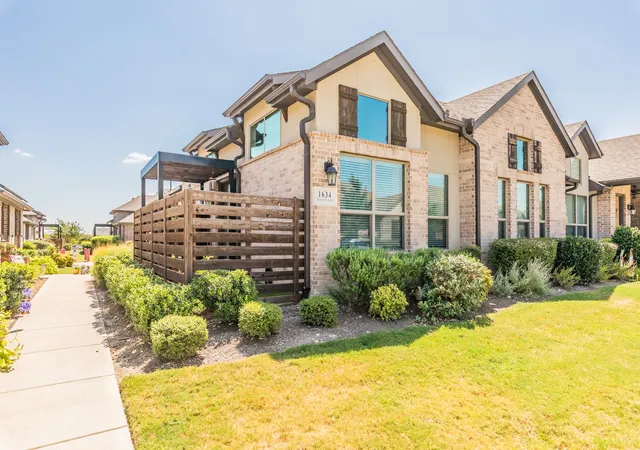 Photo 1 of Townhouse for sale at 1634 Dewberry Ln, Garland, TX 75042 | MLS# 21359675 | Listing updated on 2026-08-15