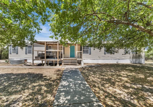 Photo 1 of Manufactured home for sale at 163 Hcr 3255, Mount Calm, TX 76673 | MLS# 21360343 | Listing updated on 2026-08-16