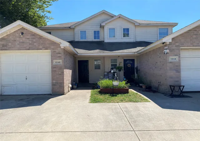 Photo 1 of Townhouse for sale at 1244 Village Garden Dr, Azle, TX 76020 | MLS# 21389359 | Listing updated on 2026-09-18