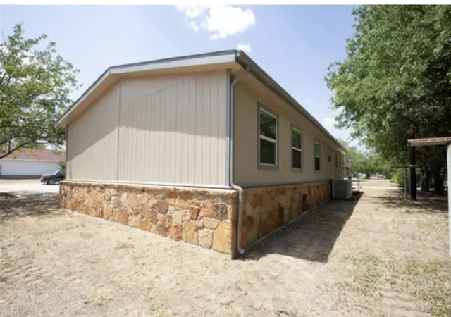 Photo 3 of Manufactured home for sale at 128 Burkhalter St, Graford, TX 76449 | MLS# 21398684 | Listing updated on 2026-10-01