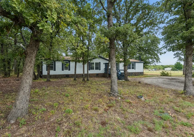 Photo 1 of Manufactured home for sale at 104 Arunda Ct, Weatherford, TX 76085 | MLS# 21400786 | Listing updated on 2026-10-01