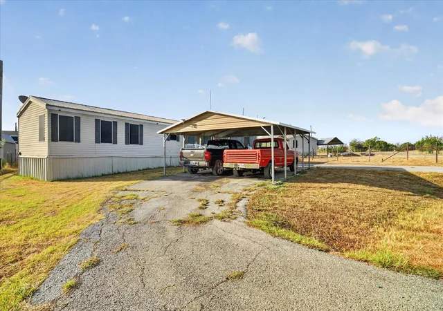 Photo 3 of Manufactured home for sale at 5703 N Sunchase Dr, Granbury, TX 76049 | MLS# 21401713 | Listing updated on 2026-10-02