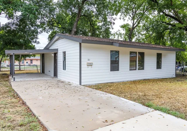 Photo 1 of Single family home for sale at 311 Glenfield Dr, Garland, TX 75040 | MLS# 21403506 | Listing updated on 2026-10-09