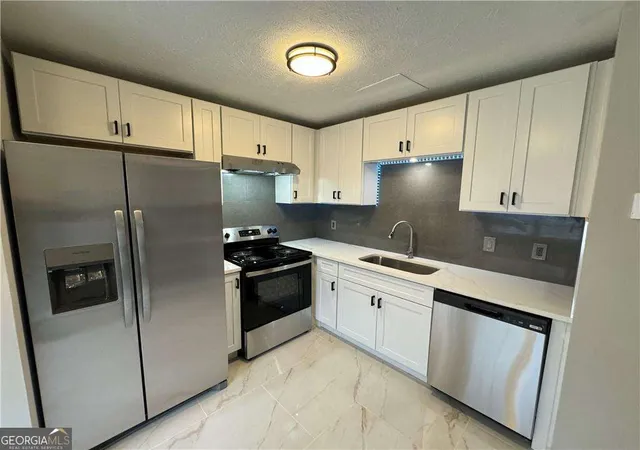 Photo 3 of Multi family home for sale at 5223 Ridge Forest Dr, Stone Mountain, GA 30083 | MLS# 10820928 | Listing updated on 2026-09-19
