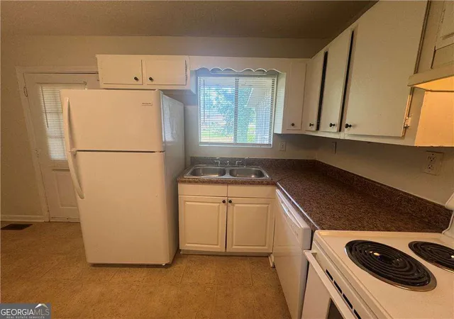 Photo 2 of Single family home for sale at 8497 Stonewall Jackson Dr, Jonesboro, GA 30238 | MLS# 10820933 | Listing updated on 2026-09-17