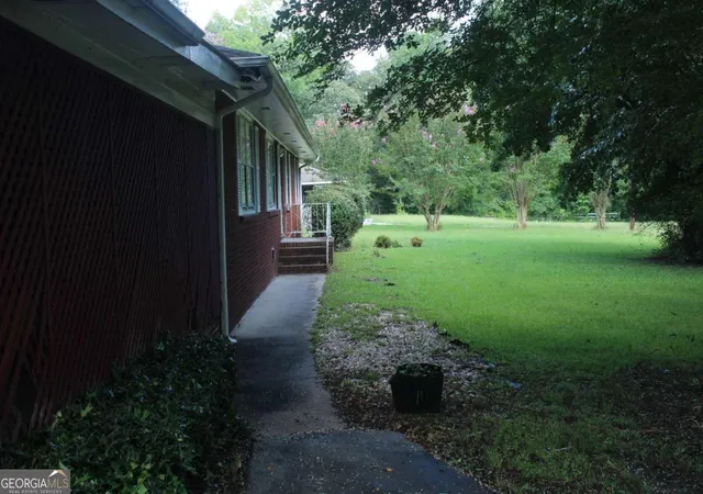 Photo 2 of Land for sale at 4460 Stonewall Tell Rd, Atlanta, GA 30349 | MLS# 10593891 | Listing updated on 2026-01-29