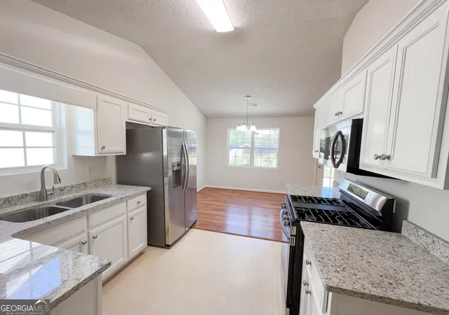 Photo 2 of Single family home for sale at 124 Amelia Garden Wy, Lawrenceville, GA 30045 | MLS# 10709312 | Listing updated on 2026-10-08