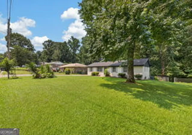 Photo 2 of Single family home for sale at 899 E Glochester Pl, Norcross, GA 30071 | MLS# 10810878 | Listing updated on 2026-09-13