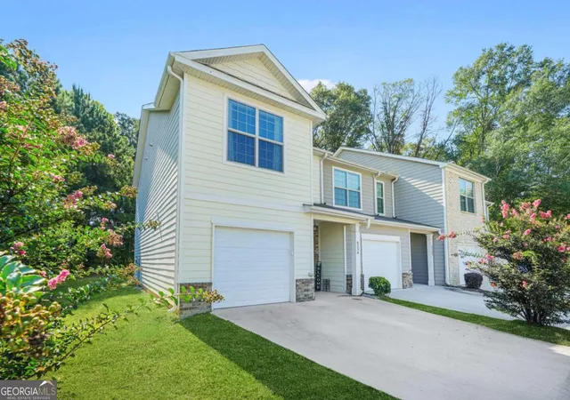 Photo 2 of Townhouse for sale at 6256 Trickle Bnd, Atlanta, GA 30349 | MLS# 10693700 | Listing updated on 2026-04-13