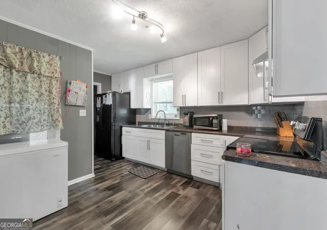 Photo 4 of Single family home for sale at 4854 Rosewood Dr SW, Lilburn, GA 30047 | MLS# 10797632 | Listing updated on 2026-10-05