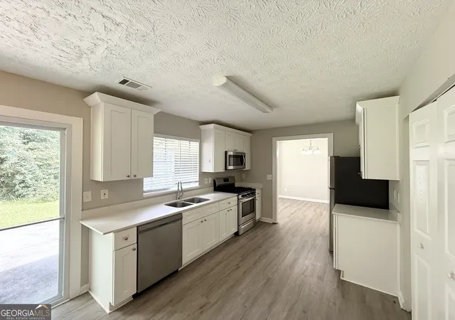 Photo 3 of Single family home for sale at 6563 Eastbriar Dr, Lithonia, GA 30058 | MLS# 10829204 | Listing updated on 2026-10-23