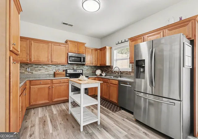 Photo 3 of Townhouse for sale at 136 Meeting Pl, Lawrenceville, GA 30044 | MLS# 10825430 | Listing updated on 2026-08-27