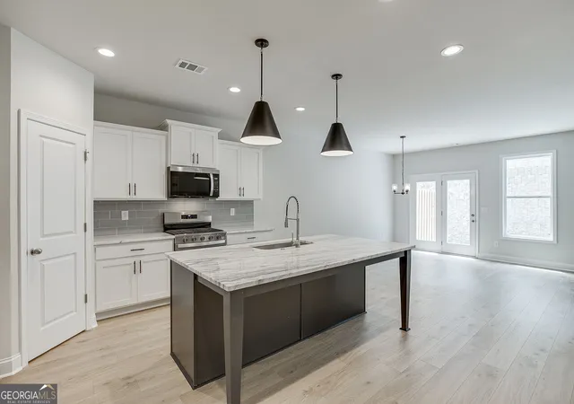 Photo 4 of Townhouse for sale at 753 Woods Chapel Rd #LOT 100, Sugar Hill, GA 30518 | MLS# 10829803 | Listing updated on 2026-10-05