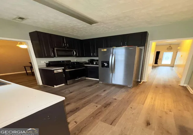 Photo 4 of Single family home for sale at 1410 Cambridge Ct, Riverdale, GA 30296 | MLS# 10772795 | Listing updated on 2026-08-02