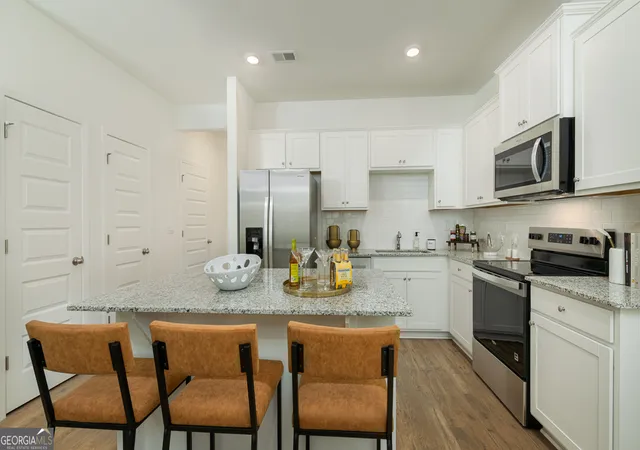 Photo 4 of Townhouse for sale at 1403 Sweetshrub Pl NW #21, Atlanta, GA 30318 | MLS# 10801176 | Listing updated on 2026-08-17