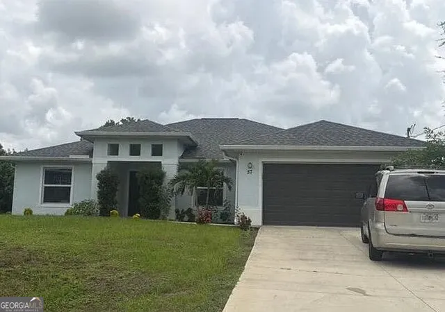 1st image of 57 Bruce Ave S, Lehigh Acres, FL 33976 | MLS# 10832791