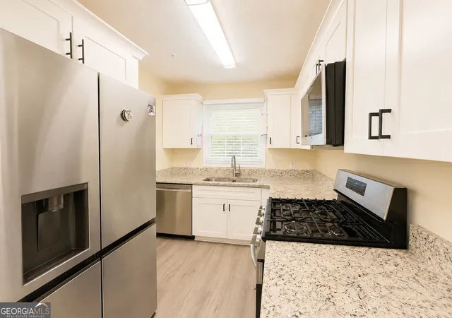 Photo 2 of Townhouse for sale at 2244 Wellington Cir, Lithonia, GA 30058 | MLS# 10829112 | Listing updated on 2026-09-04