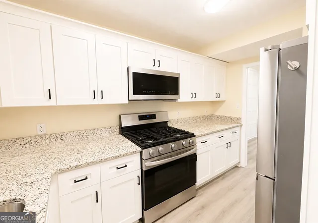 Photo 3 of Townhouse for sale at 2244 Wellington Cir, Lithonia, GA 30058 | MLS# 10829112 | Listing updated on 2026-09-04