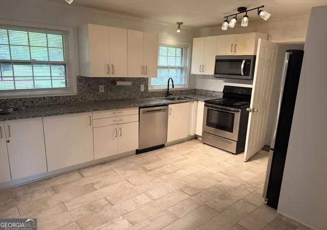 Photo 2 of Single family home for sale at 2677 Lancaster Dr, Atlanta, GA 30344 | MLS# 10790254 | Listing updated on 2026-08-30