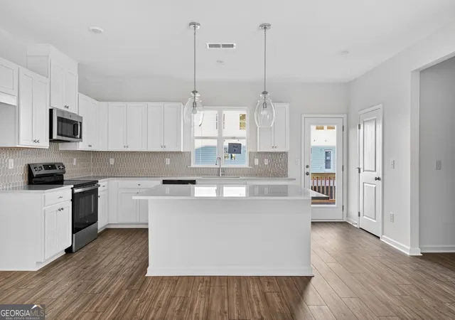 Photo 3 of Townhouse for sale at 100 Epperly Way, Tucker, GA 30084 | MLS# 10768578 | Listing updated on 2026-09-18