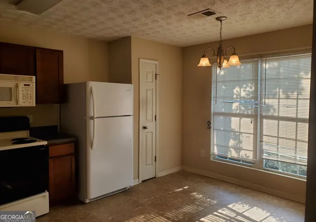 Photo 3 of Townhouse for sale at 11420 S Grove Dr, Hampton, GA 30228 | MLS# 10824928 | Listing updated on 2026-08-27