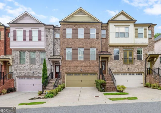 Photo 1 of Townhouse for sale at 9009 Woodland Trl, Alpharetta, GA 30009 | MLS# 10772186 | Listing updated on 2026-06-10