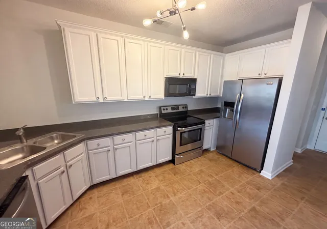 Photo 2 of Townhouse for sale at 7553 Rutgers Cir, Fairburn, GA 30213 | MLS# 10800721 | Listing updated on 2026-09-06