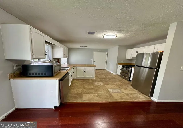 Photo 2 of Single family home for sale at 824 Greenhedge Dr, Stone Mountain, GA 30088 | MLS# 10782855 | Listing updated on 2026-09-15