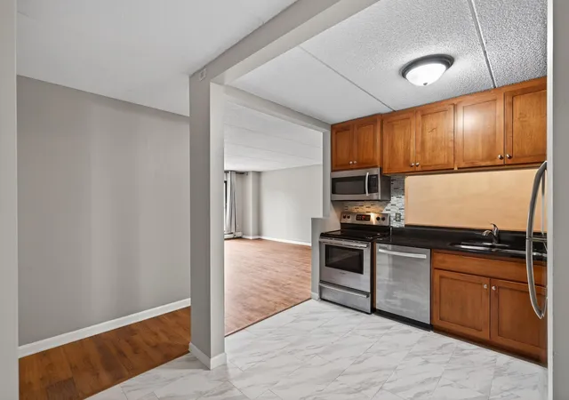 Listing Photo 1 - Condo for sale in building located at 10501 Cedar Lake Rd, Minnetonka, MN 55305 - Unit #318