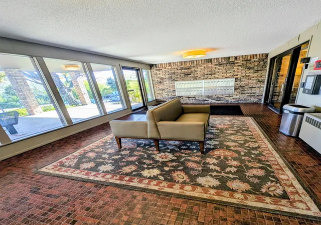 Listing Photo 1 - Condo for sale in building located at 215 Barry Ave S, Wayzata, MN 55391 - Unit #120