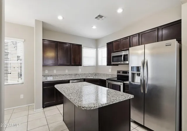 Photo 3 of Townhouse for sale at 1947 N 77th Glen, Phoenix, AZ 85035 | MLS# 7060050 | Listing updated on 2026-09-13