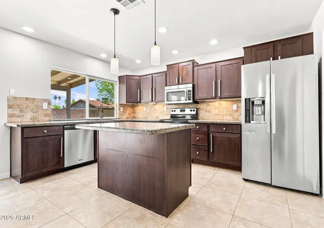 Photo 2 of Single family home for sale at 1041 W Kilarea Ave, Mesa, AZ 85210 | MLS# 7060418 | Listing updated on 2026-09-13