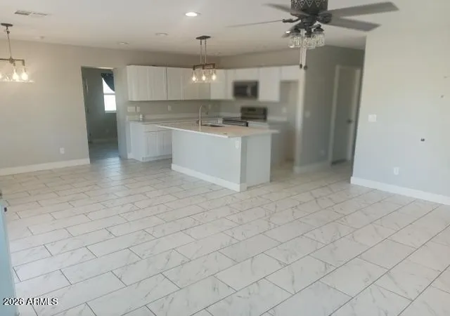 Photo 3 of Single family home for sale at 302 3rd Avenue E, Buckeye, AZ 85326 | MLS# 7067633 | Listing updated on 2026-09-11