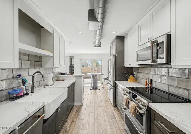 Photo 1 of Townhouse for sale at 6159 E Indian School Rd #103, Scottsdale, AZ 85251 | MLS# 7071632 | Listing updated on 2026-10-05