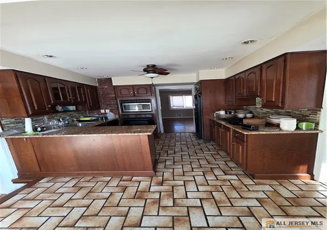Photo 4 of Single family home for sale at 112 Hill Holw Rd, South Plainfield, NJ 07080 | MLS# 2661368M | Listing updated on 2026-03-01