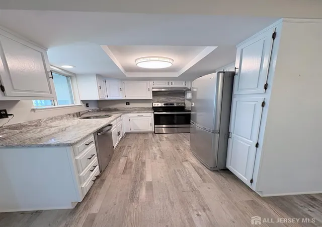Photo 2 of Townhouse for sale at 350 Jutland Dr #A, Monroe, NJ 08831 | MLS# 2703453R | Listing updated on 2026-09-26