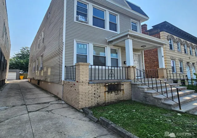 Photo 3 of Multi family home for sale at 115 Tremont Ave, East Orange, NJ 07018 | MLS# 2702859R | Listing updated on 2026-09-17