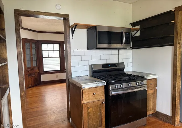 Photo 3 of Single family home for sale at 8127 Garfield Blvd, Cleveland, OH 44125 | MLS# 5231237 | Listing updated on 2026-08-29