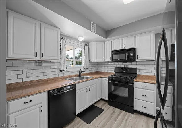 Photo 3 of Sale Pending at 9011 Roedean Dr, Parma, OH 44129 | MLS# 5237005 | Listing updated on 2026-09-01