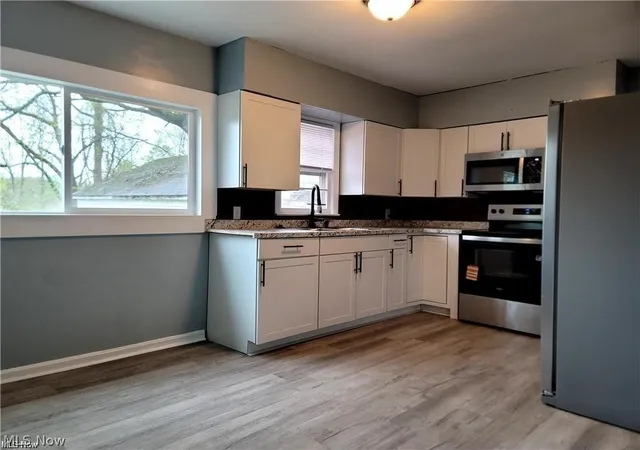 Photo 2 of Multi family home for sale at 1039 Anna Ave, Kent, OH 44240 | MLS# 5240625 | Listing updated on 2026-08-28