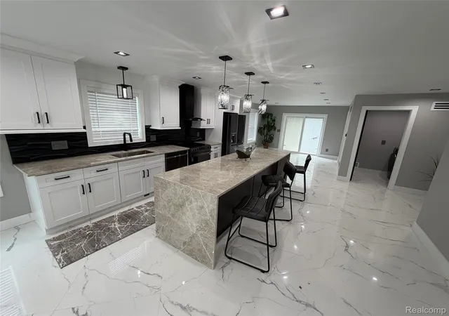 Photo 3 of Single family home for sale at 561 E Walled Lake Dr, Walled Lake, MI 48390 | MLS# 20261048678 | Listing updated on 2026-09-17
