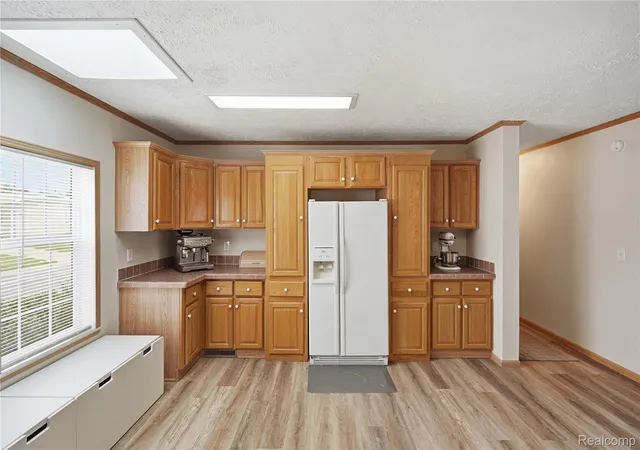 Photo 3 of Single family home for sale at 11078 Stony River Ct #522, South Lyon, MI 48178 | MLS# 20261049519 | Listing updated on 2026-07-06