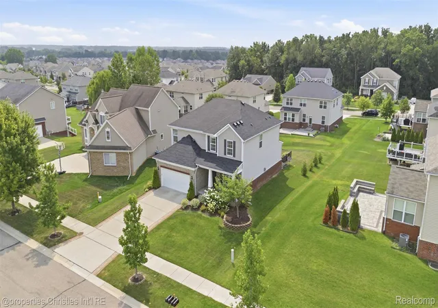 1st image of 57909 Cider Mill Dr, New Hudson, MI 48165 | MLS# 20261064999