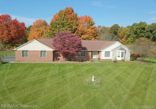 Single family home for sale at 12945 Autumn Ridge Ct, Milford, MI 48380 | MLS# 20261082732