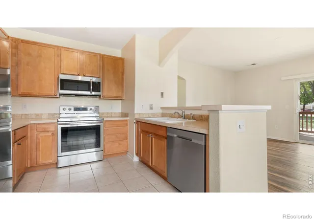 Listing Photo 1 - Condo for sale in building located at 4655 Hahns Peak Dr, Loveland, CO 80538 - Unit #101