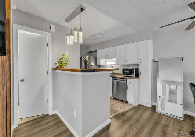 Listing Photo 1 - Condo for sale in building located at 1830 Newland Ct, Lakewood, CO 80214 - Unit #101